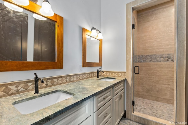 11790 Huckleberry Dr, Franktown, CO 80116 - bathroom with double vanity, a shower stall, and tile walls