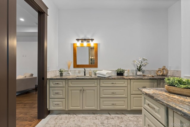 11790 Huckleberry Dr, Franktown, CO 80116 - ensuite bathroom with vanity, wood finished floors, and recessed lighting