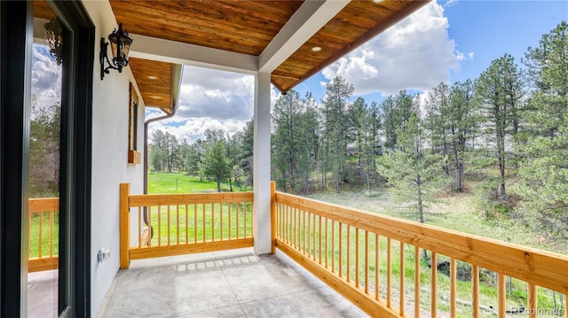 11790 Huckleberry Dr, Franktown, CO 80116 - balcony featuring view of wooded area