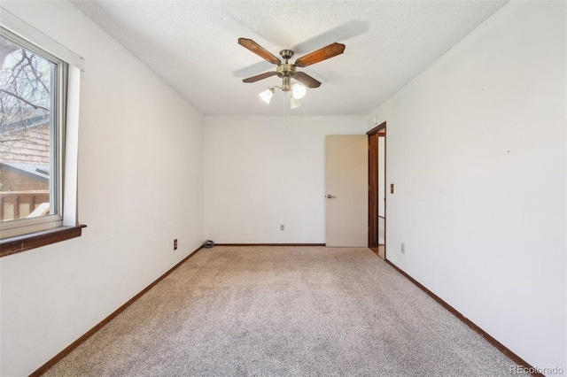 10262 W Ida Ave Unit 243, Littleton, CO 80127 - empty room featuring light colored carpet, a ceiling fan, a textured ceiling, and baseboards