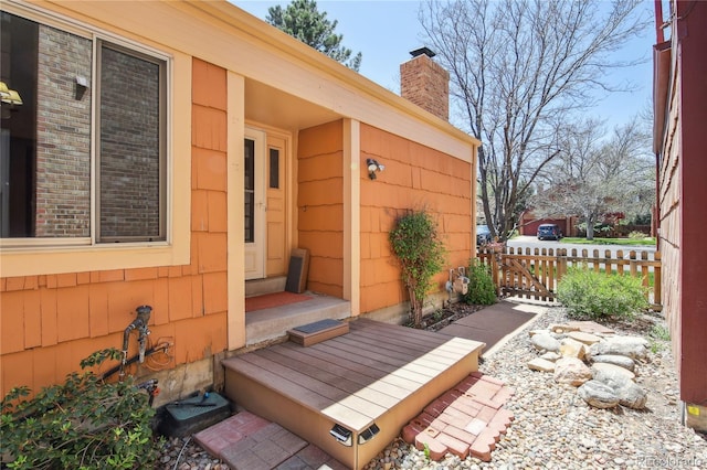 10262 W Ida Ave Unit 243, Littleton, CO 80127 - view of exterior entry featuring a chimney