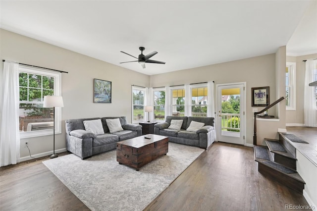 9385 Prairie View Dr, Highlands Ranch, CO 80126 - living area with ceiling fan, wood finished floors, and stairs