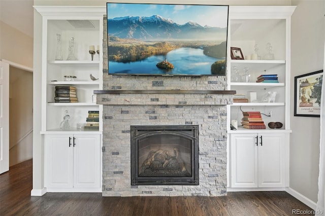 9385 Prairie View Dr, Highlands Ranch, CO 80126 - detailed view of wood finished floors, built in shelves, and a stone fireplace