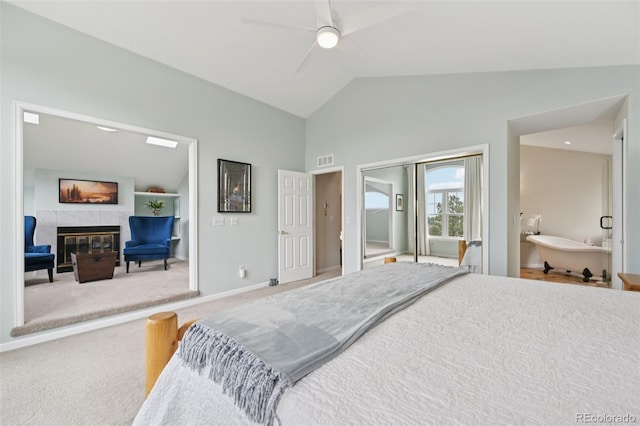 9385 Prairie View Dr, Highlands Ranch, CO 80126 - bedroom featuring carpet floors, a ceiling fan, high vaulted ceiling, and a tile fireplace