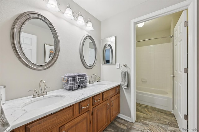 9385 Prairie View Dr, Highlands Ranch, CO 80126 - full bath with double vanity, tub / shower combination, and marble finish floors