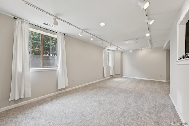 9385 Prairie View Dr, Highlands Ranch, CO 80126 - carpeted empty room featuring rail lighting and baseboards