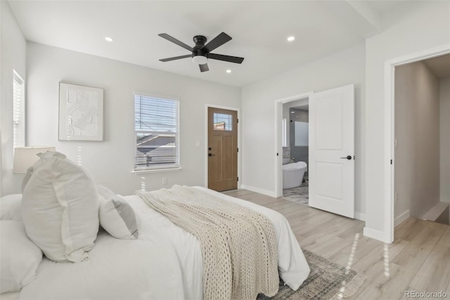 bedroom with ceiling fan, connected bathroom, and light hardwood / wood-style flooring