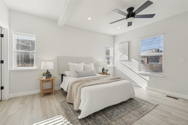 bedroom featuring beam ceiling, ceiling fan, and light wood-type flooring