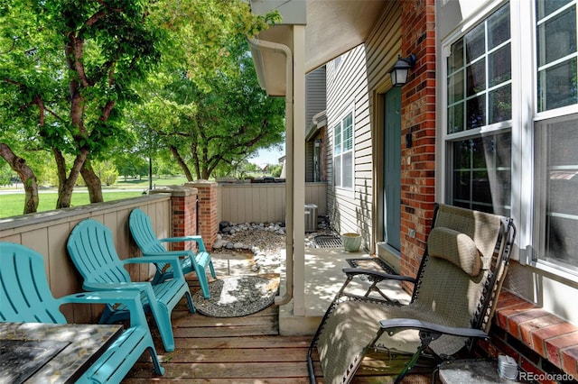 10035 E Mexico Ave, Aurora, CO 80247 - wooden terrace with central air condition unit