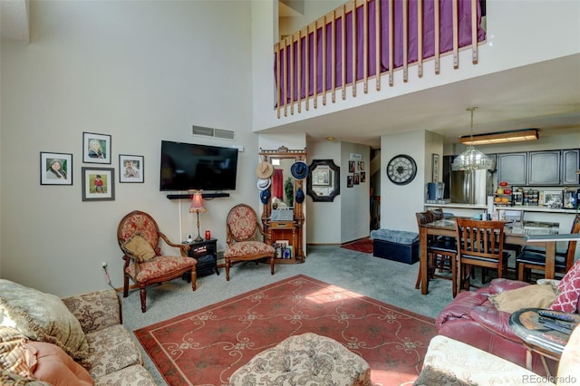 10035 E Mexico Ave, Aurora, CO 80247 - living area with carpet flooring and a high ceiling