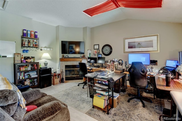 10035 E Mexico Ave, Aurora, CO 80247 - office with a tiled fireplace and lofted ceiling