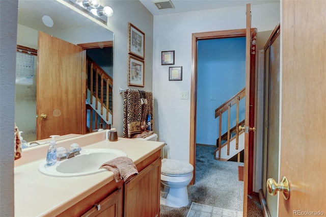 10035 E Mexico Ave, Aurora, CO 80247 - full bath featuring vanity, toilet, and a shower