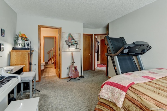 10035 E Mexico Ave, Aurora, CO 80247 - bedroom featuring light colored carpet and a textured ceiling