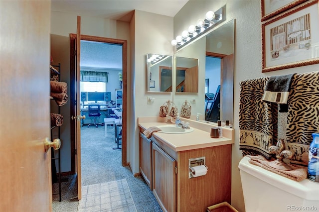 10035 E Mexico Ave, Aurora, CO 80247 - bathroom with toilet and vanity
