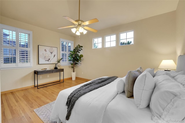 bedroom featuring hardwood / wood-style flooring and ceiling fan