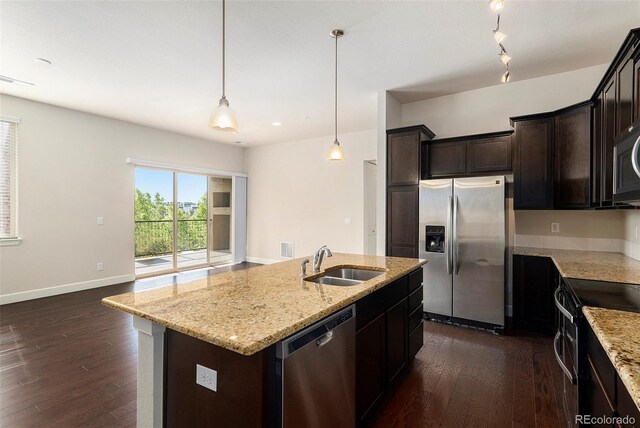 301 Inverness Way S Unit 202, Englewood, CO 80112 - kitchen with stainless steel appliances, a sink, dark wood-style flooring, and light stone countertops