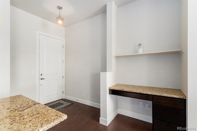 301 Inverness Way S Unit 202, Englewood, CO 80112 - foyer entrance featuring dark wood-style flooring, baseboards, and built in desk