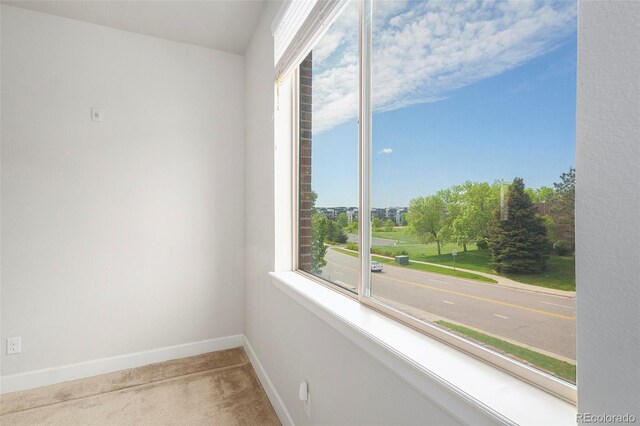 301 Inverness Way S Unit 202, Englewood, CO 80112 - unfurnished room featuring carpet flooring, healthy amount of natural light, and baseboards