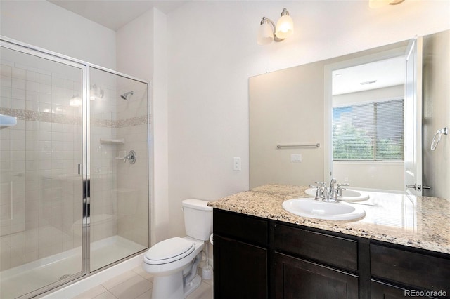 301 Inverness Way S Unit 202, Englewood, CO 80112 - bathroom with a shower stall, toilet, vanity, and tile patterned floors