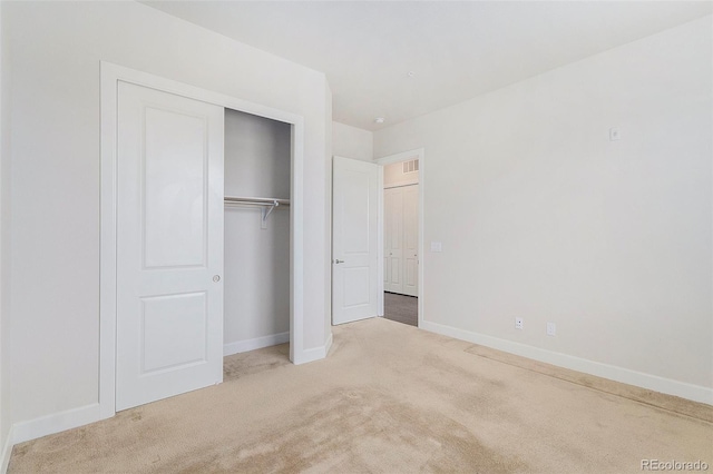 301 Inverness Way S Unit 202, Englewood, CO 80112 - unfurnished bedroom featuring carpet, baseboards, and a closet