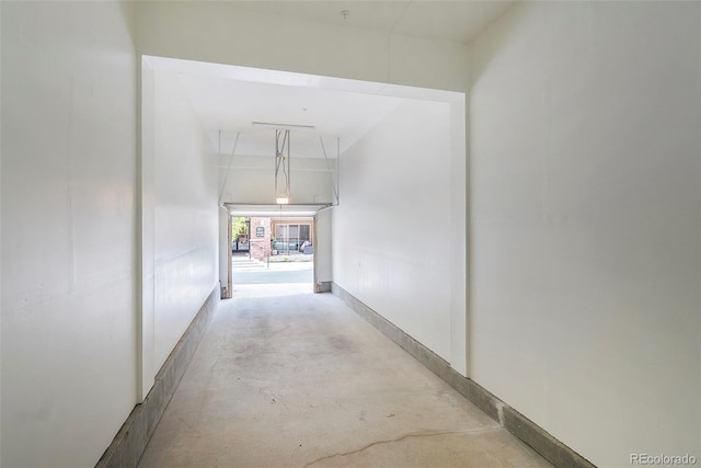 301 Inverness Way S Unit 202, Englewood, CO 80112 - hallway featuring concrete floors and attic access