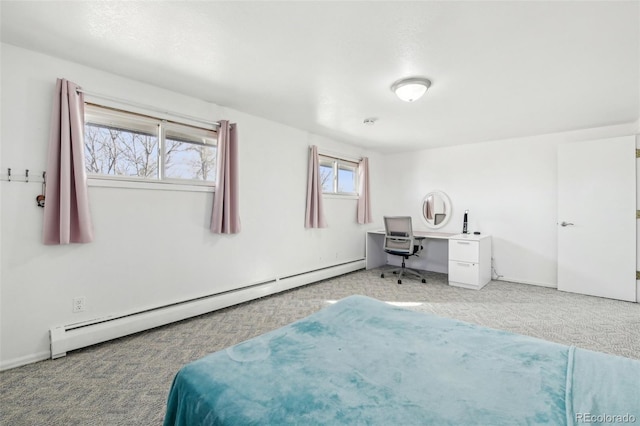 carpeted bedroom featuring baseboard heating