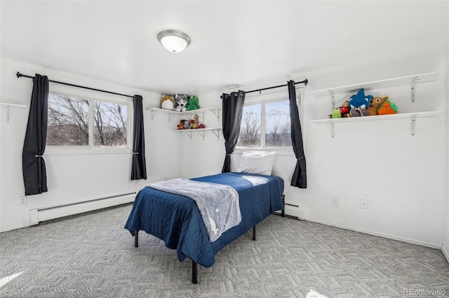 bedroom with carpet, a baseboard radiator, and multiple windows