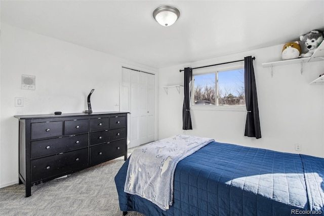 bedroom with carpet floors and a closet