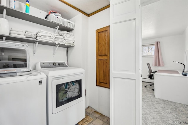 laundry area featuring light carpet and independent washer and dryer