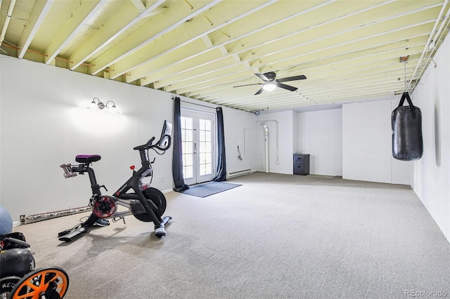 exercise area featuring french doors, ceiling fan, and baseboard heating