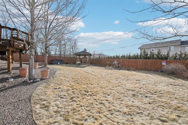 view of yard featuring a gazebo and a fenced backyard