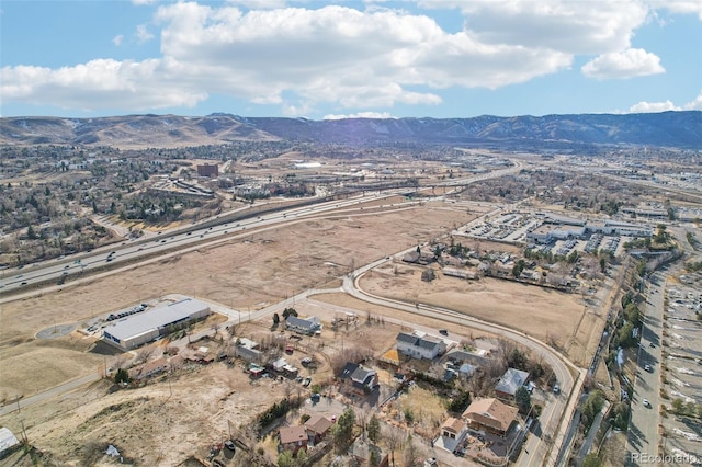 birds eye view of property featuring a mountain view