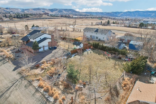 birds eye view of property with a mountain view