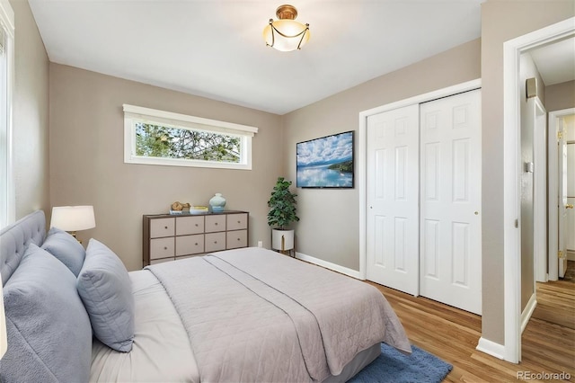 5142 S Pennsylvania St, Littleton, CO 80121 - bedroom with a closet, light wood-style floors, and baseboards