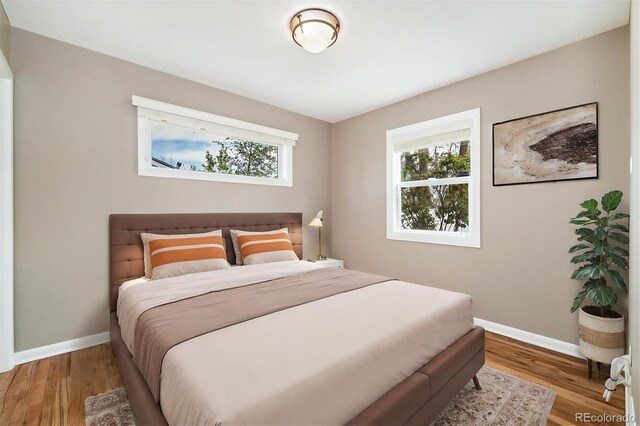 5142 S Pennsylvania St, Littleton, CO 80121 - bedroom featuring baseboards and wood finished floors