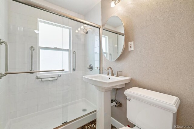 5142 S Pennsylvania St, Littleton, CO 80121 - full bath with toilet, a shower stall, and a textured wall