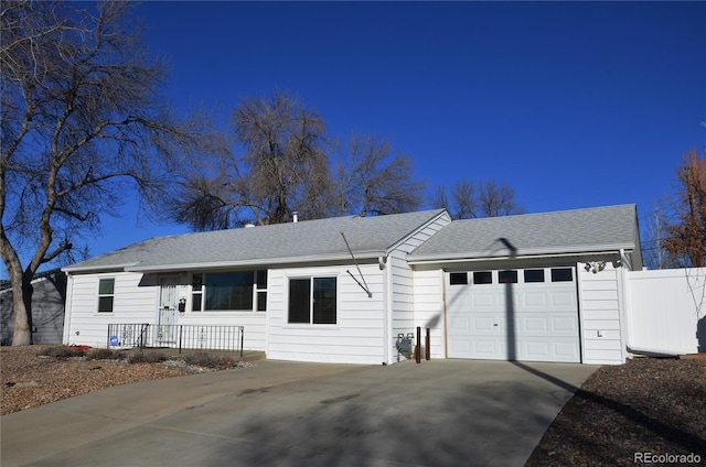 5142 S Pennsylvania St, Littleton, CO 80121 - ranch-style house with driveway, an attached garage, and a shingled roof