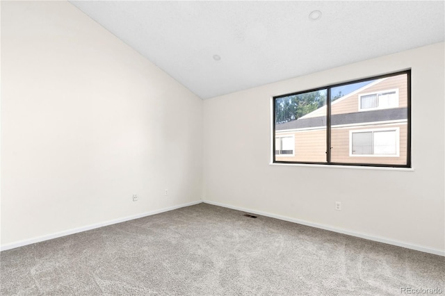 1732 S Trenton Unit 9, Denver, CO 80231 - carpeted empty room featuring baseboards and lofted ceiling