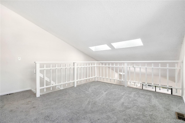 1732 S Trenton Unit 9, Denver, CO 80231 - bonus room featuring a skylight, carpet, and lofted ceiling