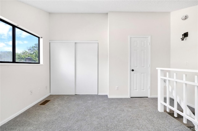 1732 S Trenton Unit 9, Denver, CO 80231 - unfurnished bedroom with carpet floors and a closet
