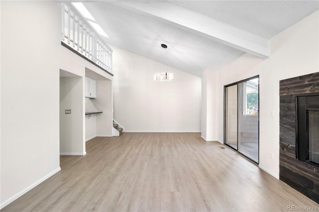1732 S Trenton Unit 9, Denver, CO 80231 - unfurnished living room featuring light wood-style floors, a fireplace, and stairway