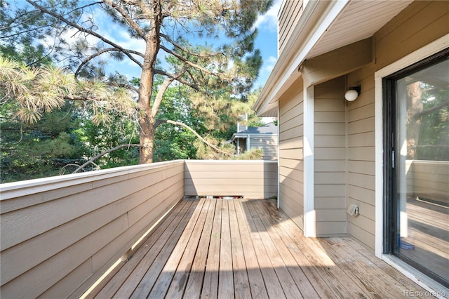 1732 S Trenton Unit 9, Denver, CO 80231 - wooden deck with view of scattered trees