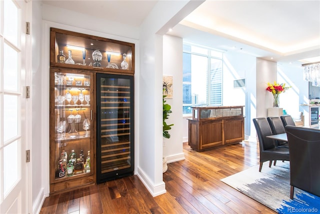 interior space with hardwood / wood-style flooring and bar area