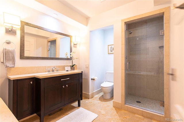 bathroom with tile patterned flooring, a shower with shower door, toilet, and vanity