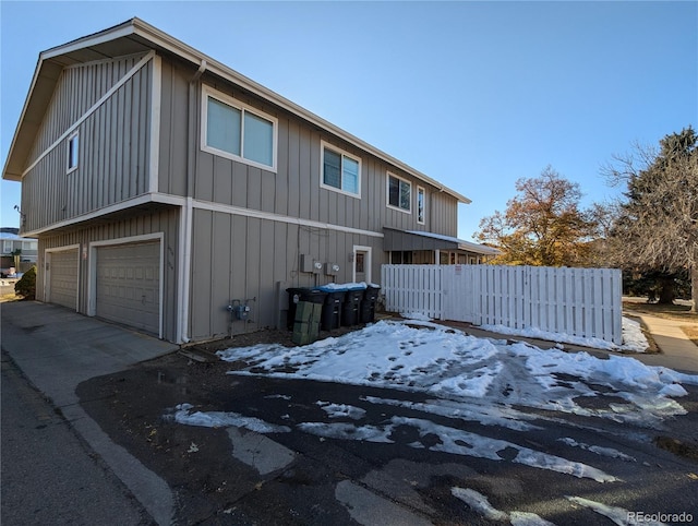 view of side of property with a garage