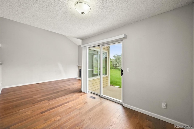 10349 W Fair Ave Unit A, Littleton, CO 80127 - empty room featuring wood finished floors, a textured ceiling, and baseboards