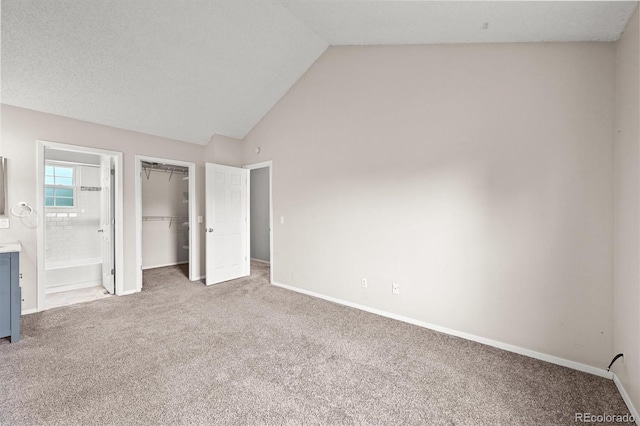 10349 W Fair Ave Unit A, Littleton, CO 80127 - unfurnished bedroom with carpet flooring, lofted ceiling, a closet, and baseboards