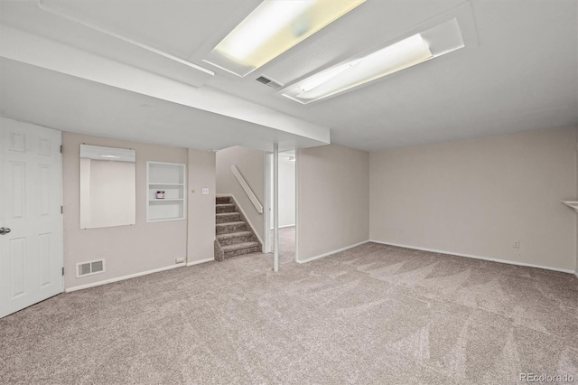 10349 W Fair Ave Unit A, Littleton, CO 80127 - finished below grade area featuring carpet, baseboards, and stairway
