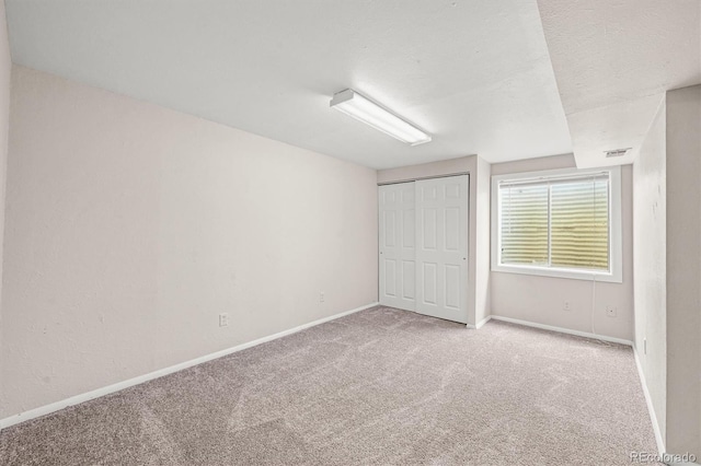 10349 W Fair Ave Unit A, Littleton, CO 80127 - unfurnished bedroom with carpet, baseboards, and a closet