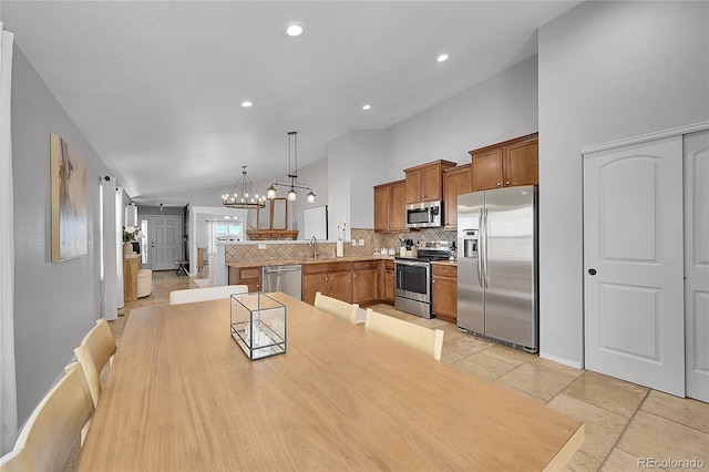 3838 Brush Rd, Castle Rock, CO 80108 - dining space featuring lofted ceiling, a chandelier, and recessed lighting